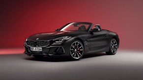 BMW Z4 roadster final edition in front of a red background.