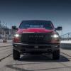 A red 2026 Ram 1500 Rebel parked on a track in direct front view