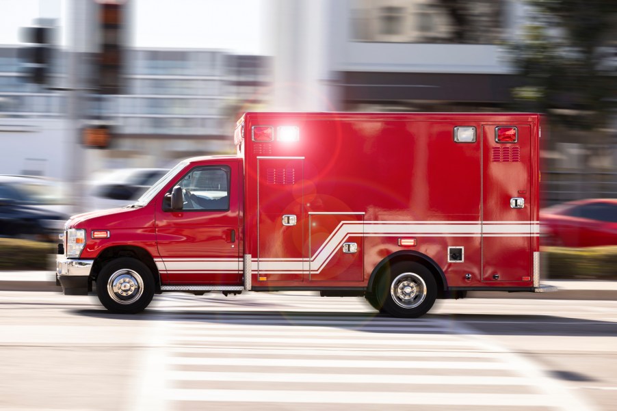 An ambulance speeding down the street