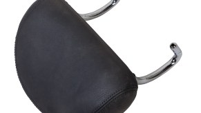 Black car headrest removed from the seat, on a white background.