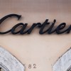The Cartier logo on the side of a tan building in Rome