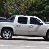 Chevrolet Avalanche pickup truck driving on a highway.