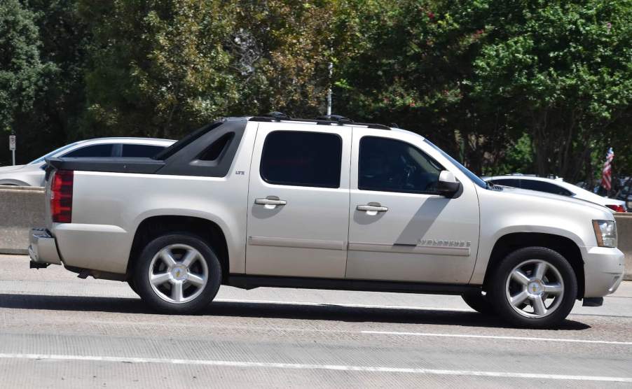 Chevrolet Avalanche pickup truck driving on a highway.