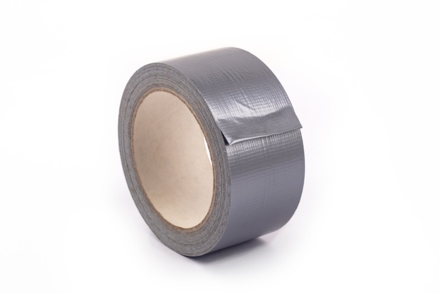 Roll of gray duct tape on a white background.