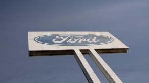 A Ford sign overhead, a blue sky in the background.