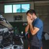 A frustrated mechanic doesn't love working on this truck.