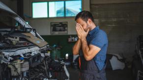 A frustrated mechanic doesn't love working on this truck.