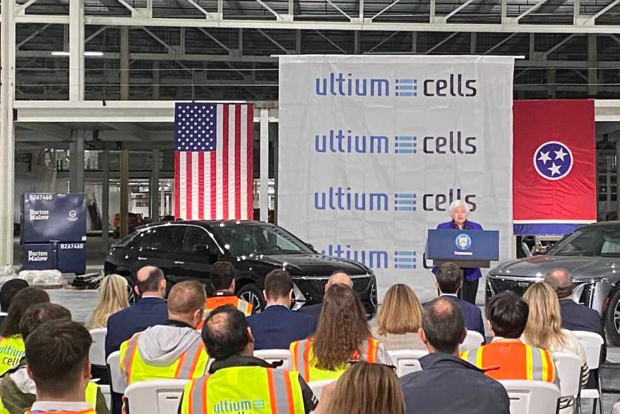 Tennessee workers at the GM Ultium battery plant listen to a woman speaking from a podium.