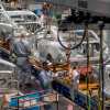 Kansas City factory workers assemble General Motors cars on an assembly line