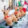 Row of inflatable reindeer on a porch