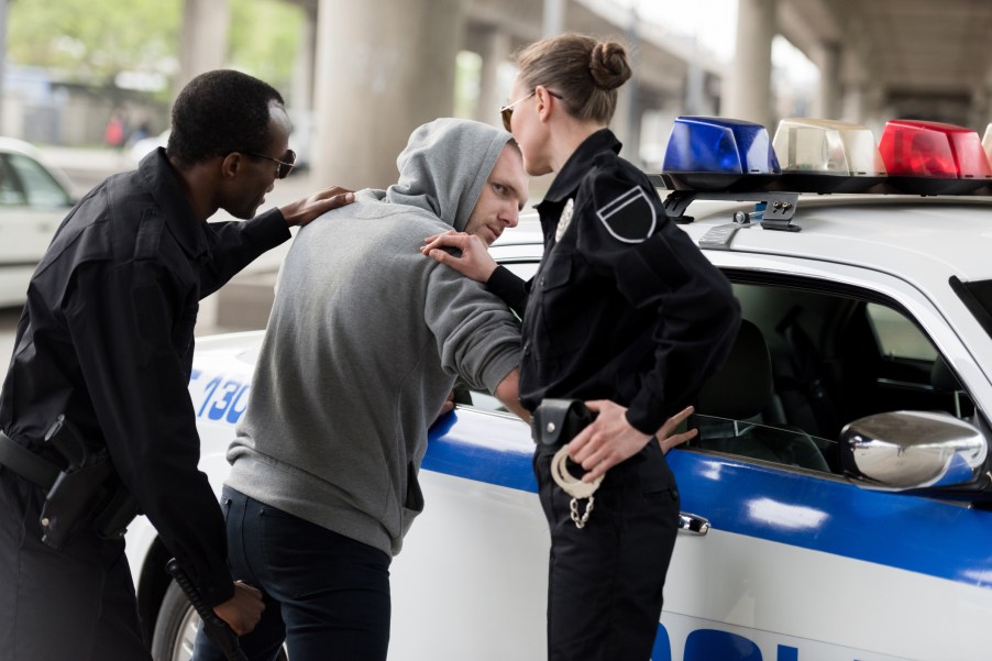 Police officers arresting a man