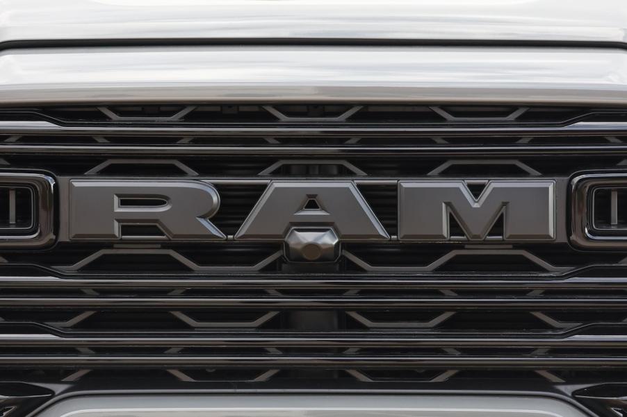 The black RAM logo on the grille of a new pickup truck