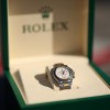 Rolex Daytona watch in green watch box
