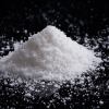 Pile of white salt on a black background