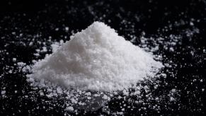 Pile of white salt on a black background