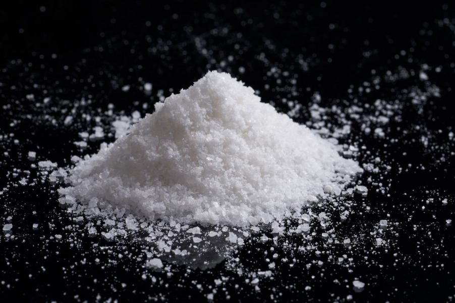 Pile of white salt on a black background