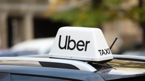 The white Uber Taxi sign on a rideshare car