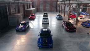 Dodge Challenger muscle cars parked in a garage in high front view