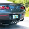 A Corvette with a Florida license plate reading "PO BOY" in close view