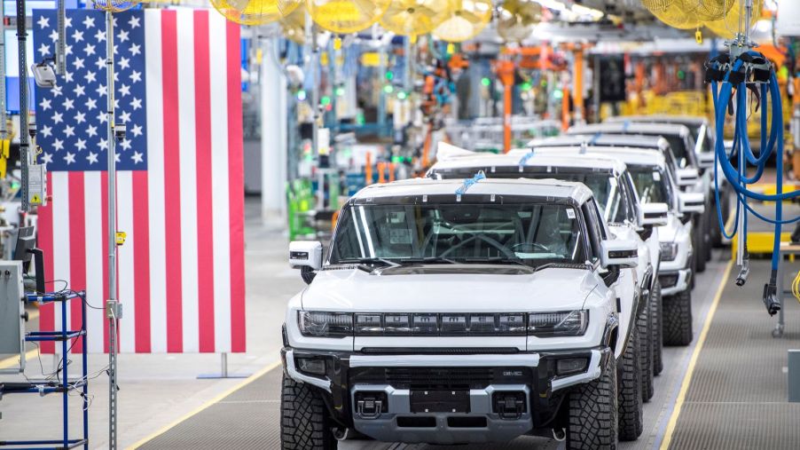 GM Hummer production line with American flag hanging from ceiling