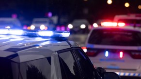 Police SUVs with their lights on