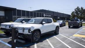 Rivian EVs parked in front of a dealership
