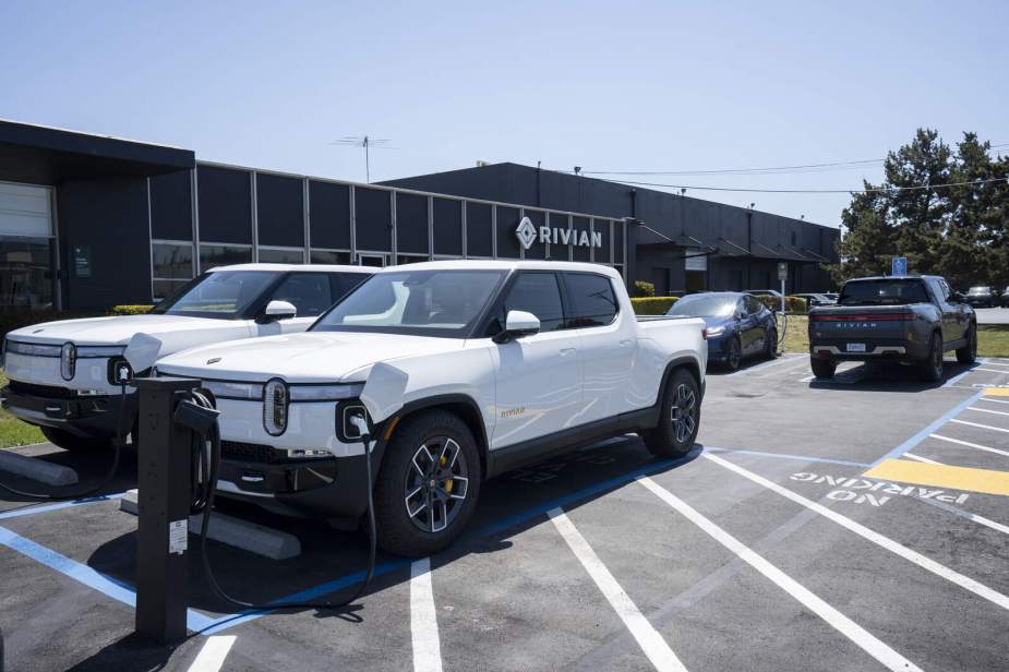 Rivian EVs parked in front of a dealership