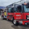 A Troy, Ohio, fire department truck parked in right front angle view with doors open
