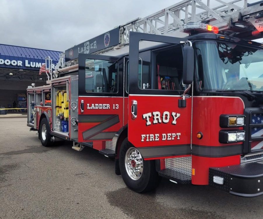 A Troy, Ohio, fire department truck parked in right front angle view with doors open