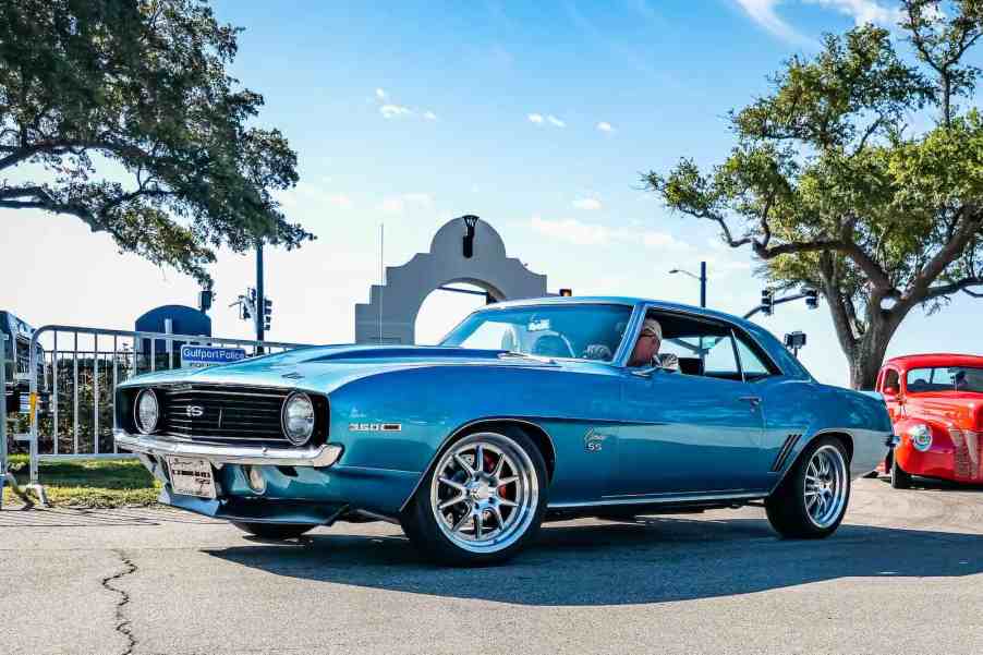 Blue 1969 Chevrolet Camaro at a car show.