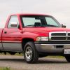 A red 1997 Dodge Ram 1500 Laramie SLT parked in right front angle view