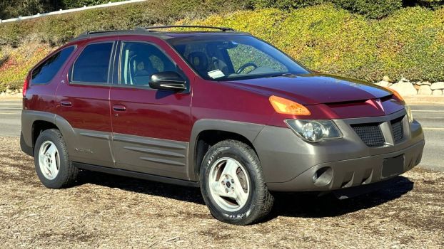 A red 2001 Pontiac Aztek parked in right front angle view