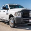 A white 2015 Dodge Ram 3500 ST Crew Cab Dually Cummins 4×4 parked in low right front angle view