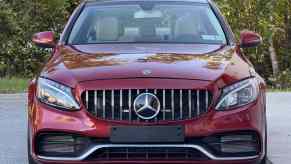A red 2017 Mercedes-Benz C300 Sedan 4MATIC parked in direct front view