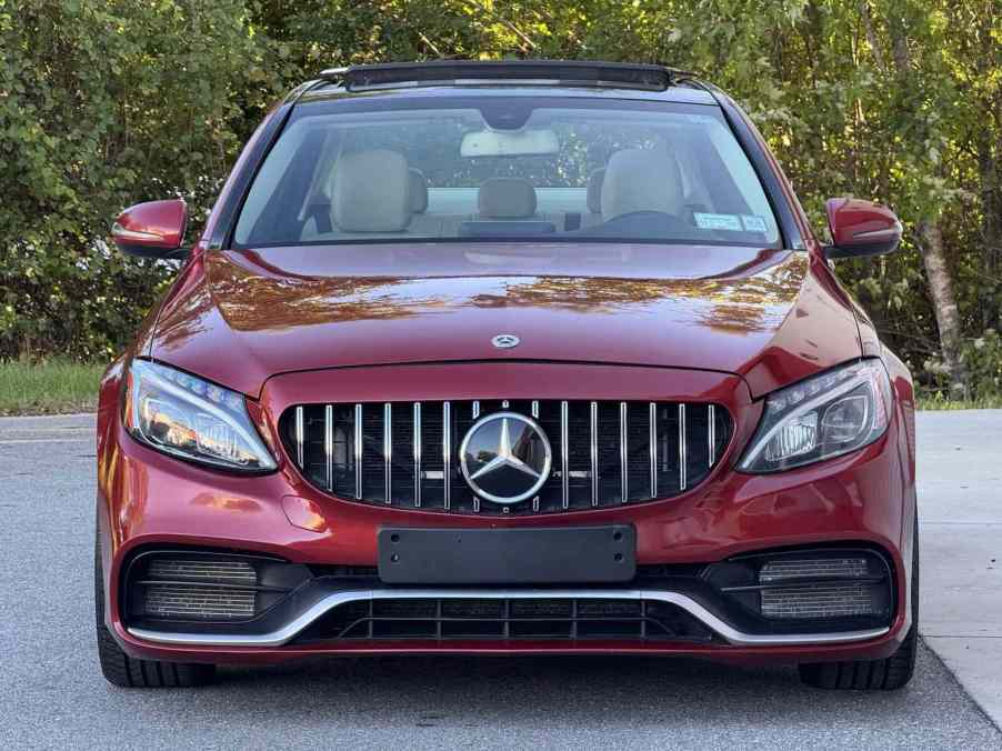 A red 2017 Mercedes-Benz C300 Sedan 4MATIC parked in direct front view