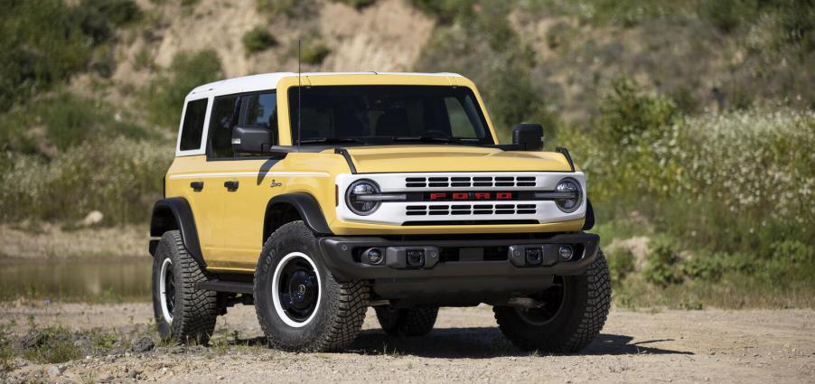 A 2023 Bronco Heritage Limited Edition in Yellowstone Metallic parked outside in right front angle view