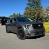 The 2025 Ford Maverick Lobo near foliage