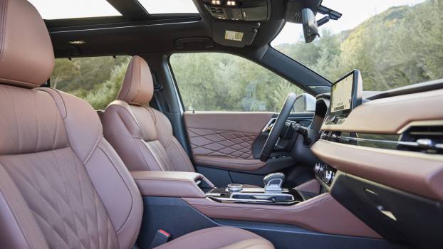 Brown leather interior in a 2025 Mitsubishi Outlander from low right front angle