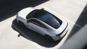 A white 2026 Honda Prelude coupe parked, so you can't rev the engine.