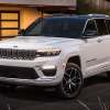 The 2026 Jeep Grand Cherokee near a home