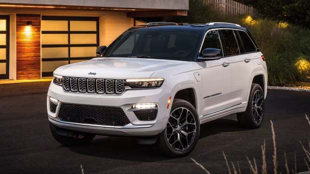 The 2026 Jeep Grand Cherokee near a home