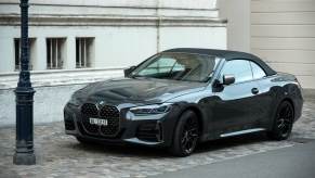 BMW convertible parked on a city street.