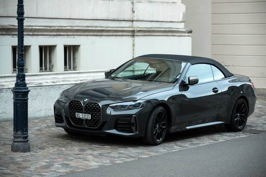 BMW convertible parked on a city street.