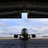 Silhouette of a Boeing 737 jet airplane entering a hanger