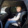 A kid in a car booster seat