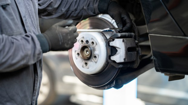 A mechanic serving brakes