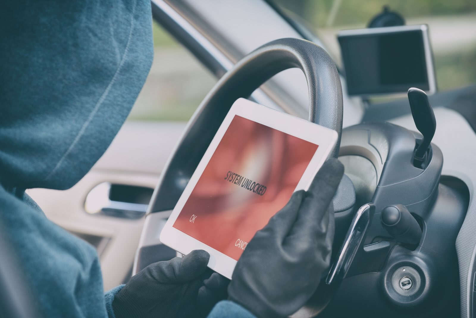 Car thief uses an electronic device to program a new key and steal a Camaro
