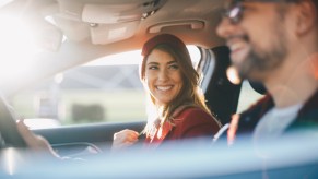 Couple in a budget-friendly sedan take a roadtrip.