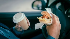A man driving while eating