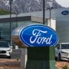 A Ford sign near electric cars